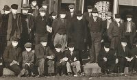 Photo: Men wearing surgical masks in Shelby, Nebraska, December 8, 1918. History Nebraska RG2017.PH